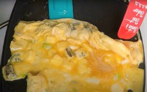 Folding The Green Chili Omelet With Cheese