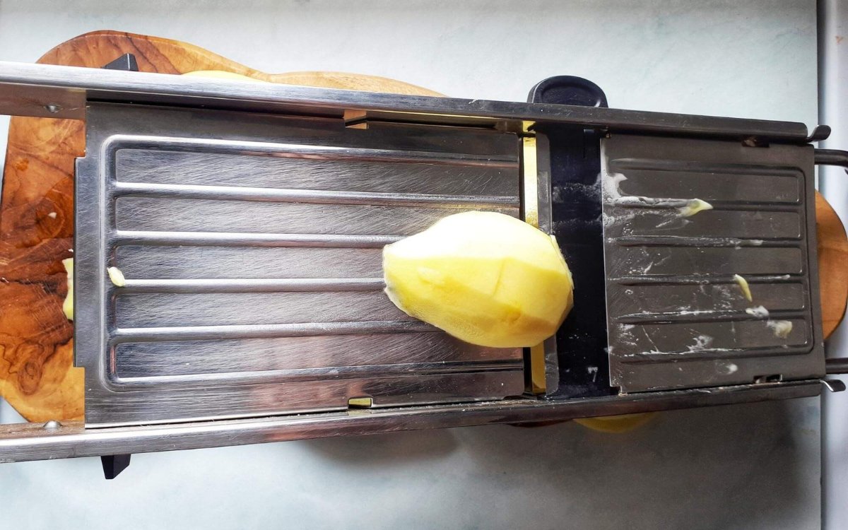 Slicing the Potatoes Using A Mandoline Slicer